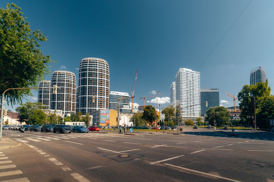View of Bratislava's skyline with modern skyscrapers and clear blue sky.