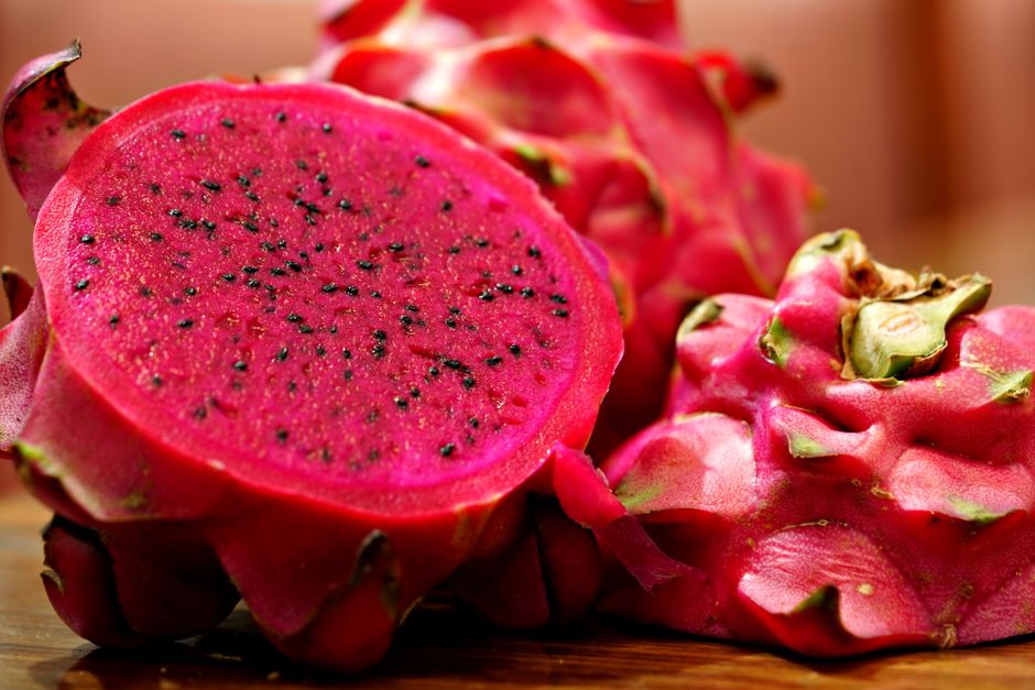 Close-up of fresh pink dragon fruit showing vibrant color and texture.