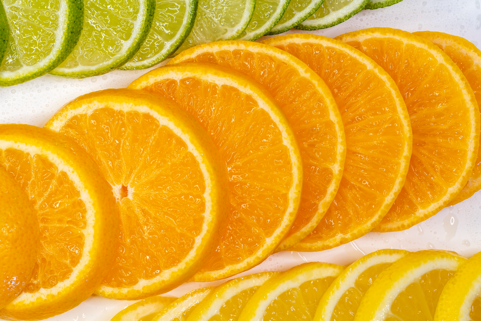 Close-up of freshly sliced citrus fruits, showcasing vibrant colors and juicy texture.