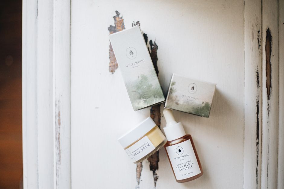 Elegant display of luxury skincare products with a natural, minimalist aesthetic.